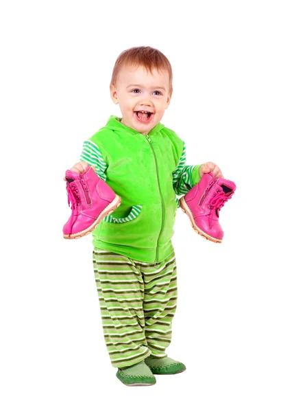 Happy toddler holds shoes — Stock Photo, Image
