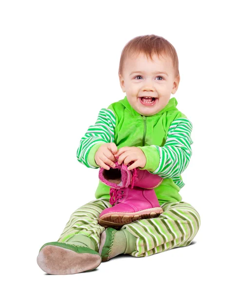 Niño pequeño sostiene zapatos — Foto de Stock