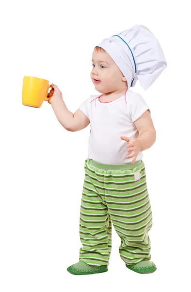 Baby cook in toque with cup — Stock Photo, Image