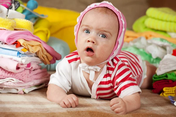 Baby with children's clothes — Stock Photo, Image