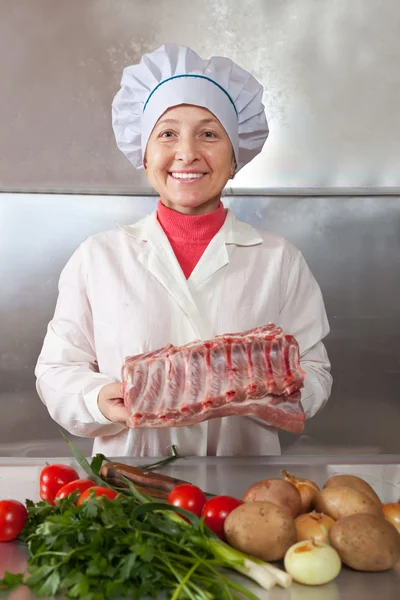 Cook woman with raw meat — Stock Photo, Image