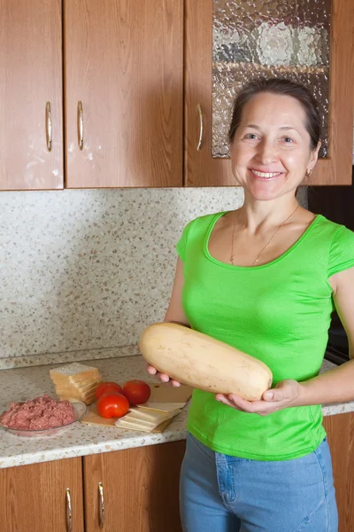 Woman with vegetable marrow — Stock Photo, Image