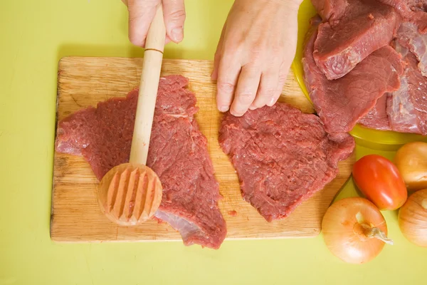 Cook hands making meat tenderizer — Stock Photo, Image