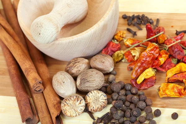 stock image Various natural spices with pestle and mortar