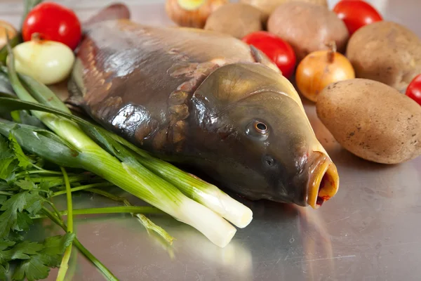 Carp fish with vegetables — Stock Photo, Image