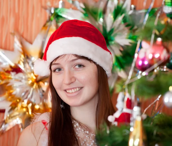 Girl in red Christmas hat — Stock fotografie