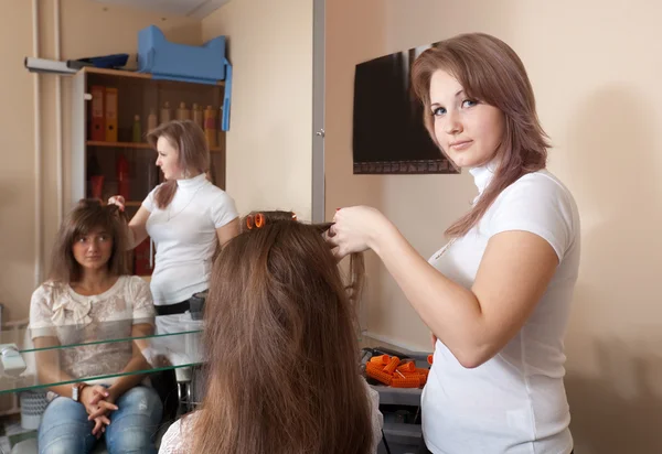 Hairdresser working with girl — Stok fotoğraf