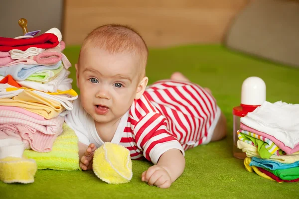 stock image Baby girl with baby's things