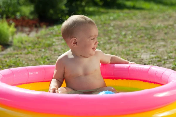 stock image Baby swimming in kid inflatable pool