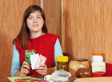 Woman with various seeds clipart