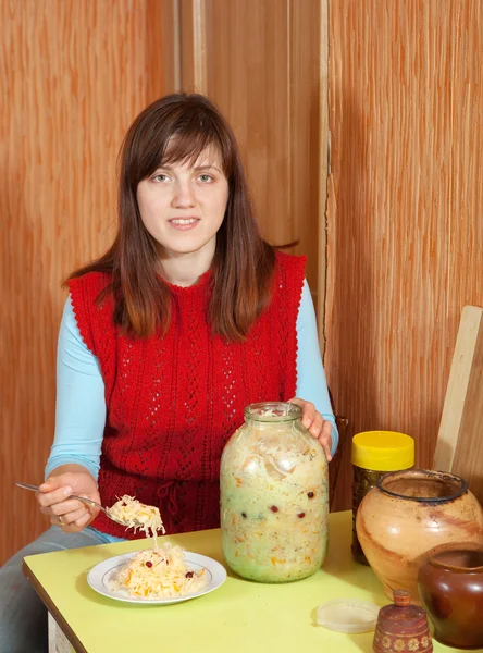 Woman with can of pickled cabbage — Stock Photo, Image