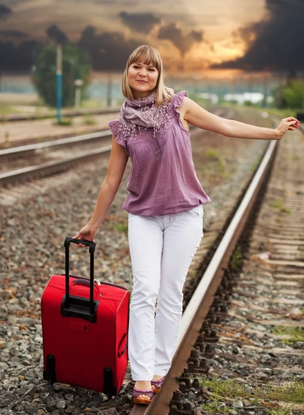 Woman walking on rail — Stock Photo, Image