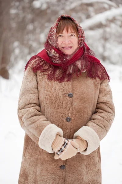 Portrait of mature woman in babushka — Stock Photo, Image