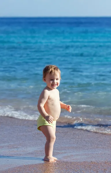 Happy toddler on sand beach — Stock Photo, Image