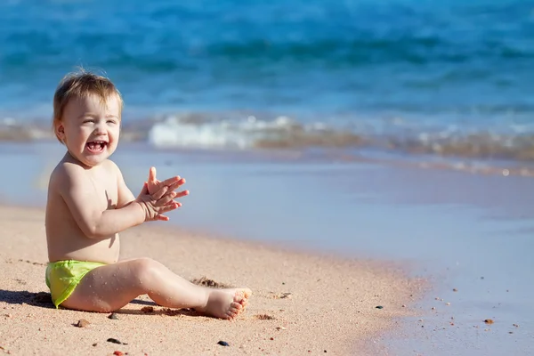 Happy toddler on sand beach — Stock Photo, Image