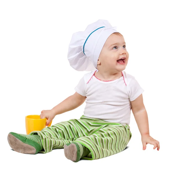 Bebê cozinheiro no toque com copo — Fotografia de Stock