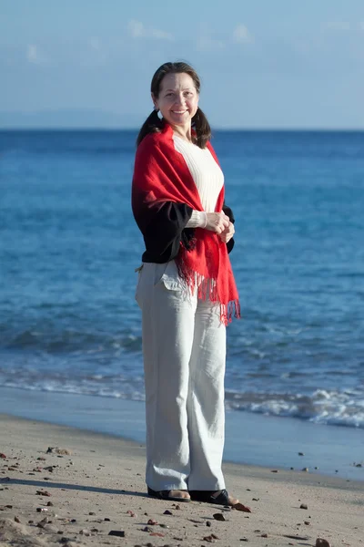 Happy mature woman on beach — Stock Photo, Image