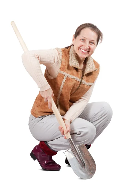 女人用铁锹铲料 — 图库照片