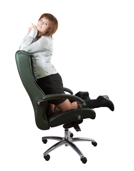 Woman kneeling on luxury office armchair — Stock Photo, Image