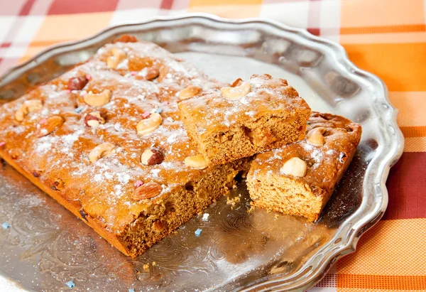 Honey cake with nuts on tray