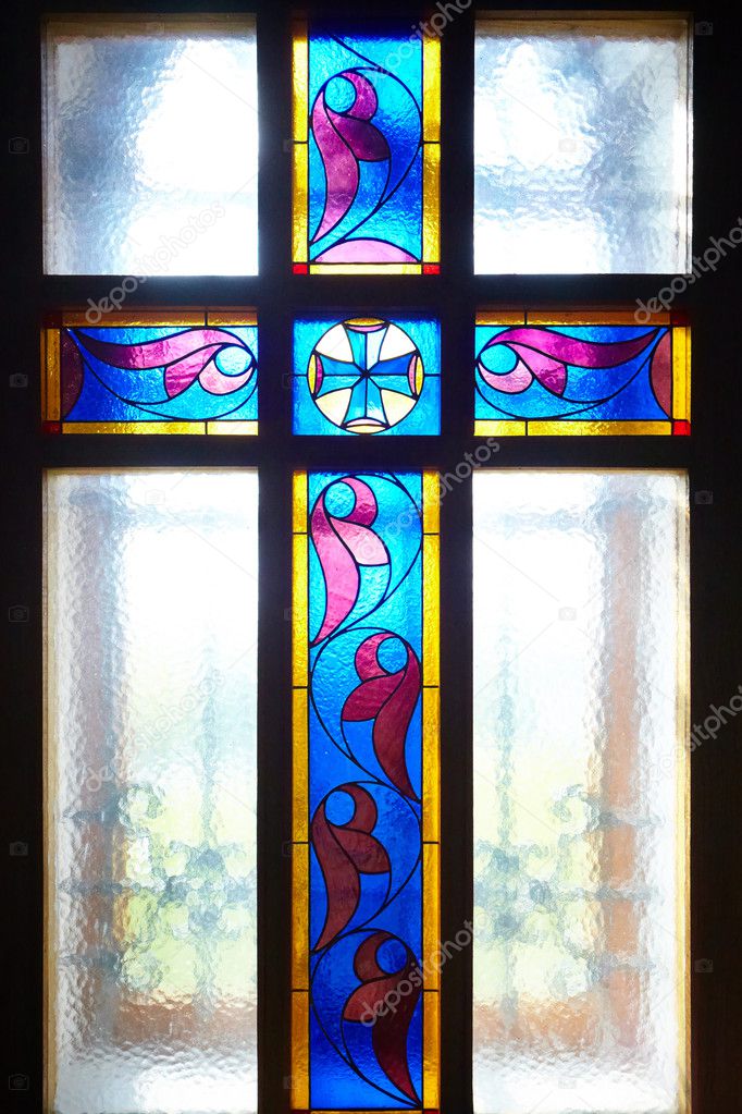 Catholic cross on the window (stained glass)