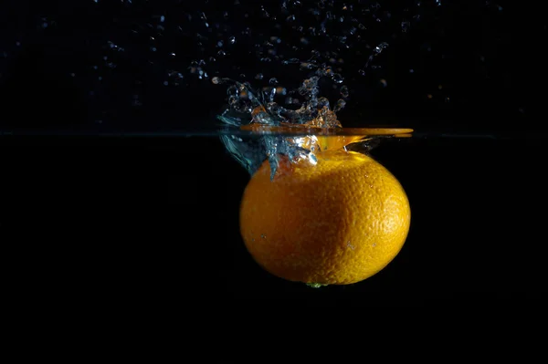 stock image Orange and splash water