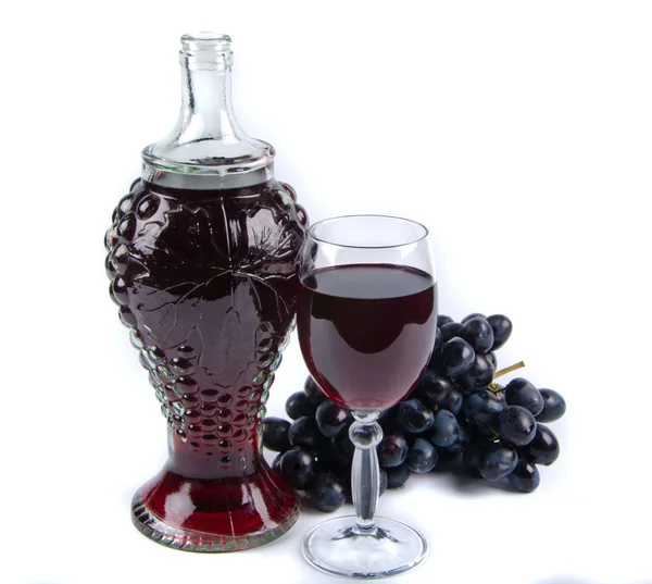 Old bottle and glass with wine and grapes — Stock Photo, Image