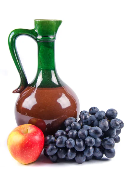 Old ceramic decanter with grapes — Stock Photo, Image