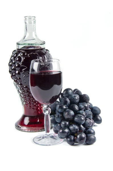 Garrafa velha e copo com vinho — Fotografia de Stock