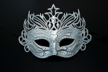 Carnival mask on the black background. clipart