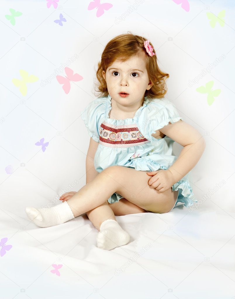 A little girl sitting