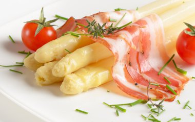 White asparagus served with ham clipart