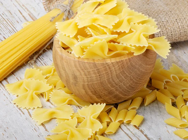 Italian pasta on a wooden table — Stock Photo, Image
