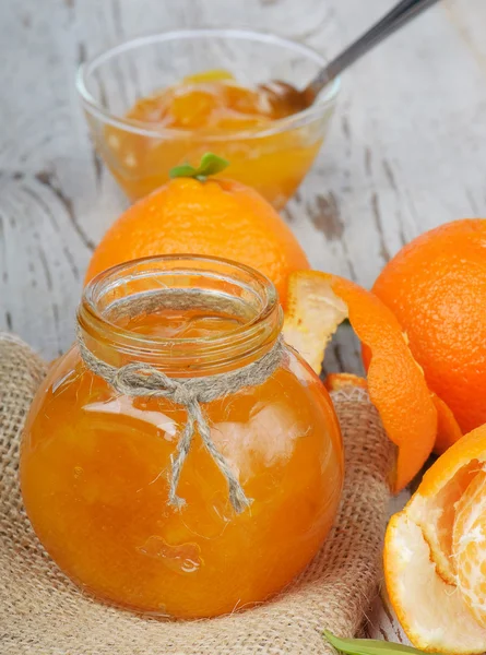 stock image Orange jam on a wooden table