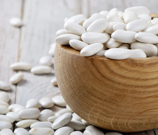 White beans on a wooden table — Stock Photo, Image