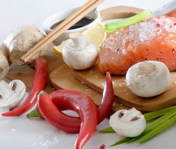 stock image Salmon steak with vegetables and soy sauce