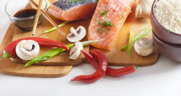 stock image Salmon steak with rice, vegetables and soy sauce