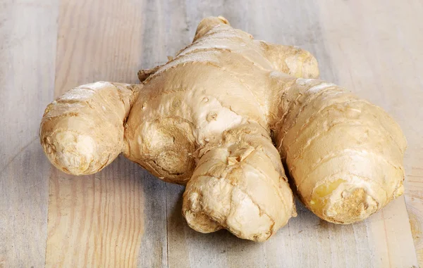 Ginger on a wooden table — Stock Photo, Image