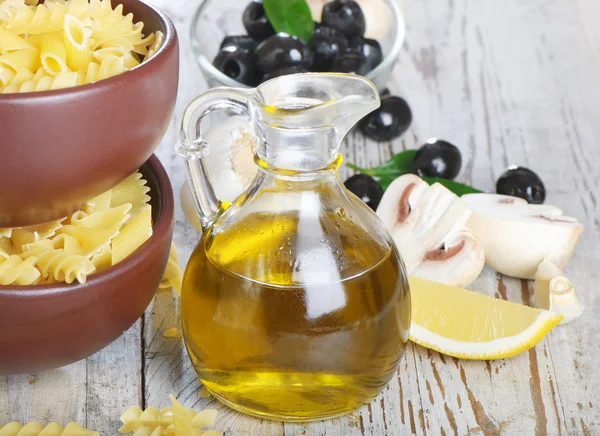 Italian cuisine - pasta and olive oil — Stock Photo, Image