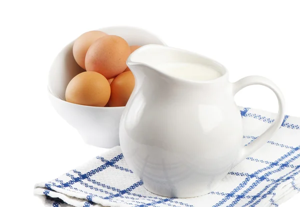 Jug with milk and eggs — Stock Photo, Image