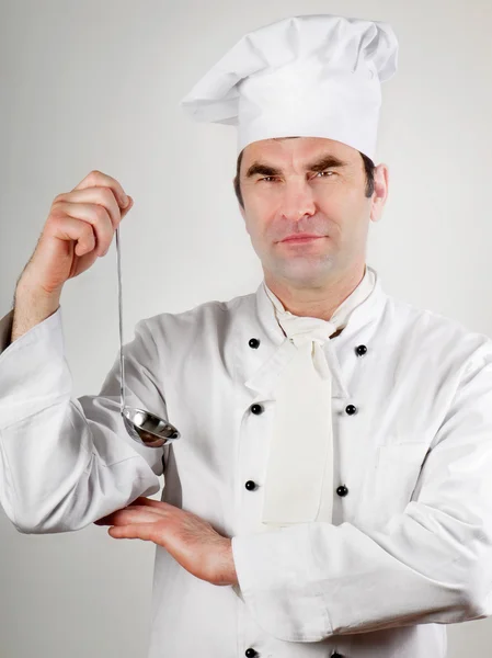 Chef holding spoon — Stock Photo, Image