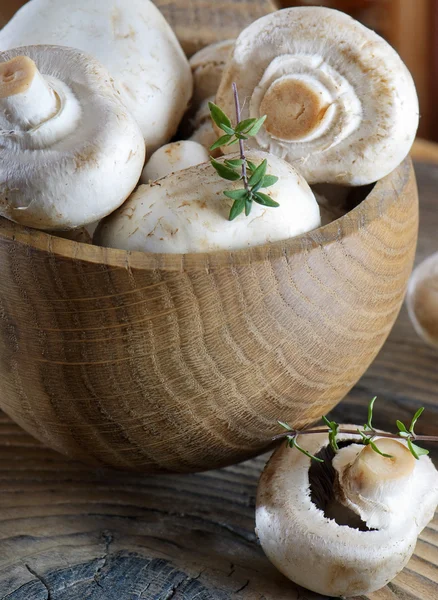Champignon on a wooden table — Stock Photo, Image