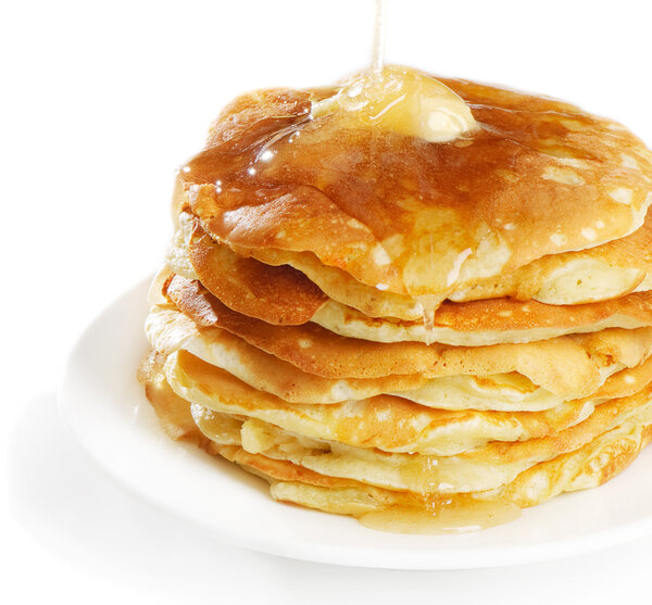 Pancakes topped with honey