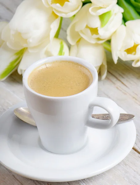 stock image Coffee cup and white tulips