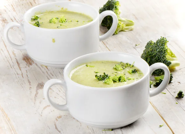 Broccoli soup on a wood background — Stock Photo, Image