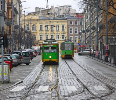 Vintage trams on a street of Poznan clipart