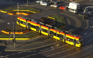 Modern tram on a street of Warsaw, Poland clipart