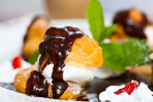 stock image Profiteroles with ice cream