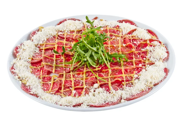 stock image Meat (beef) Carpaccio with Parmesan Cheese and ruccola