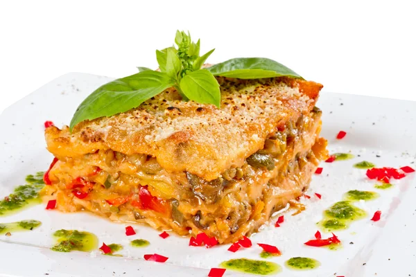 Stock image Closeup of lasagna and basil fork